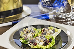 Cheesy lettuce boat appetizers are served at a New Years eve holiday party.