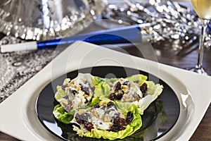 Cheesy lettuce boat appetizers are served at a New Years eve holiday party.