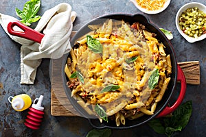 Cheesy pasta bake with ground beef and herbs