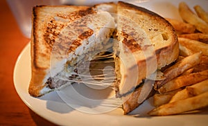 Cheesy Patty Melt with French Fries photo