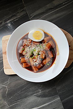 Cheesy Tteokbokki Delight on White Plate