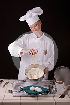 Chef adding egg