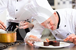 Chef as Patissier cooking in Restaurant dessert