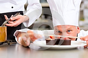 Chef as Patissier cooking in Restaurant dessert