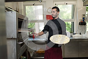 Chef baking Cheese Focaccia from Recco Italy