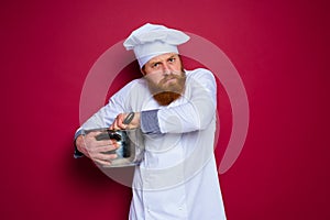 chef with beard and red apron is jealous of his recipe