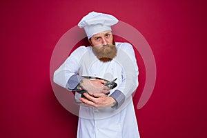 chef with beard and red apron is jealous of his recipe