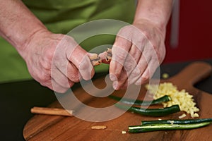 Chef breaking a cinnamonn stick