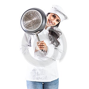 Chef brunette woman smiling from behind the pan - isolated on white