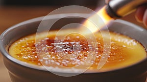 Chef caramelizing creme brulee with a torch