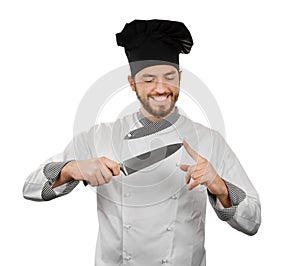 Chef checks his knife sharpness. isolated on white