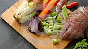 Chef chopping fresh vegetables ingredients prepared on chopping board