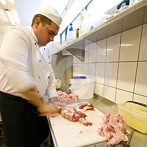 Chef chopping meat photo