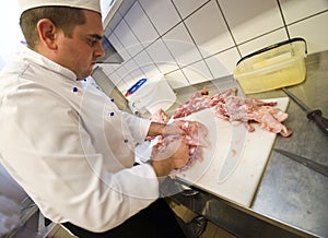 Chef chopping meat photo