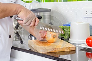 Chef chopping onion