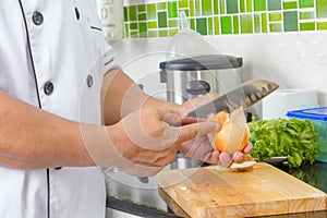 Chef chopping onion