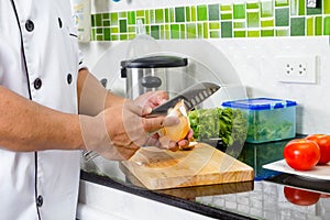 Chef chopping onion