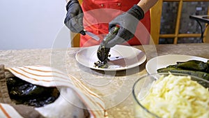 Chef cleans and removes the skin of a poblano chile to make chiles stuffed with cheese