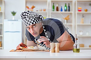 The chef cook cooking a meal breakfast dinner in the kitchen