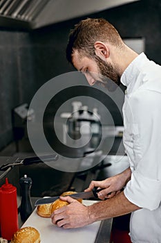 Chef Cooking Burgers in Kitchen