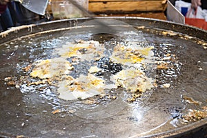 Chef cooking food fry Pan-fried crispy mussel at Street food at Yoawaraj Road