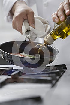 Chef Cooking Food In Frying Pan