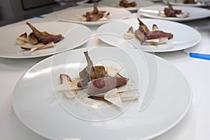 Chef cooking food with Pigeon meat for dinner party.