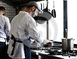 Chef cooking food in the restaurant kitchen