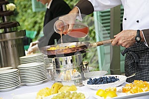 Chef is cooking fruit