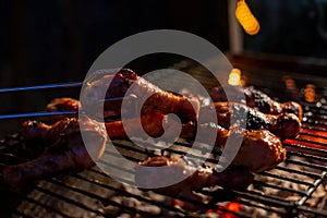 Chef cooking jerk barbecue BBQ chicken on the grill hand turning food