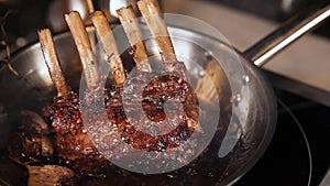 Chef cooking meat on a frying pan