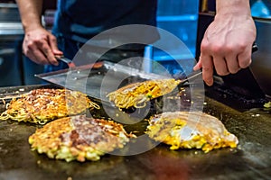 Chef is cooking Okonomiyaki