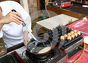 A chef is cooking an omelet for breakfast