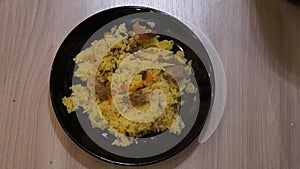 Chef cooking pilaf. Cooking process. National food. Rice and meat. Pilau