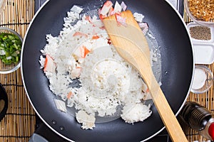 Chef cooking rice in pan