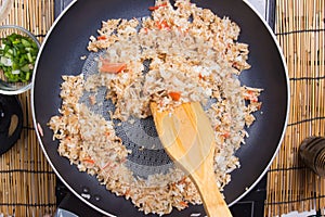 Chef cooking rice in pan