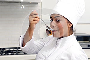 Chef cooking risotto having taste