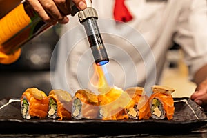 Chef cooking Salmon Foie gras roll