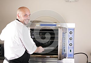 Chef cooking steak in the oven