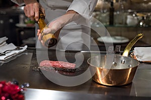 Chef cooking wagyu beef in Japanese teppanyaki restaurant, Tokyo