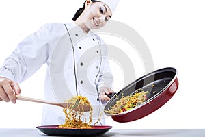 Chef cooks fried noodle