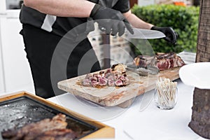 The chef cooks the veal at a plancha photo