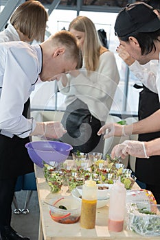 The chef covers the table with a variety of snacks