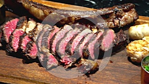 Chef cut beef on wooden Board