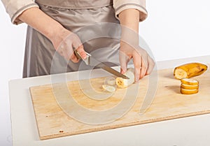 Chef cuts a banana