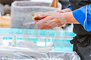 Chef cutting fresh bread for Burger