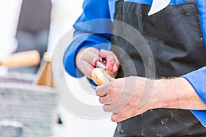 Chef cutting fresh bread for Burger