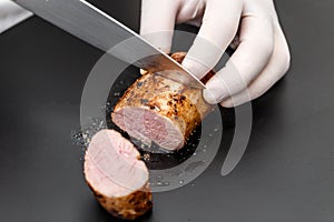 Chef cutting meat