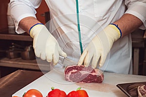 Chef cutting meat