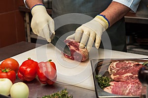 Chef cutting meat